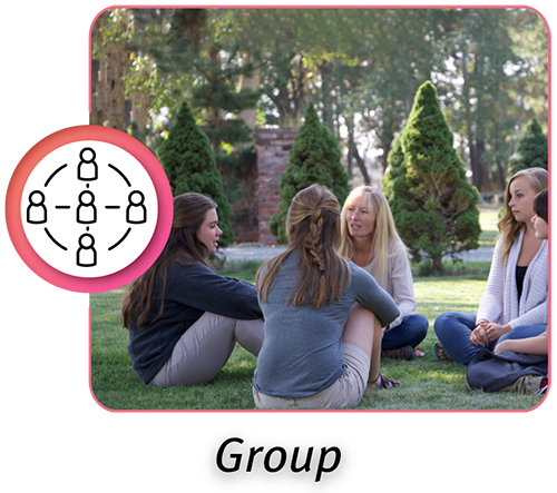 Group therapy session outdoors at a boarding school for girls
