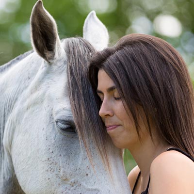 Horse and student building trust demonstrating equine assisted psychotherapy